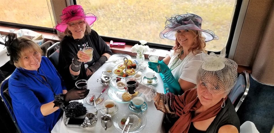 Ladies drinking tea during the high tea excursion